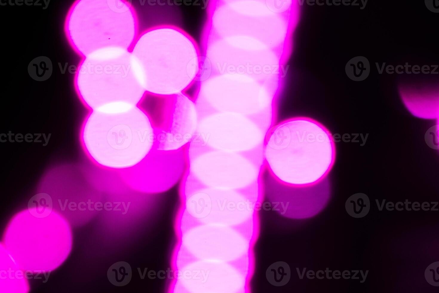 Blurred lights with purple bokeh effect Background photo