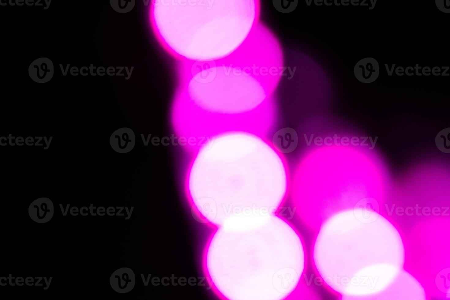 Blurred lights with purple bokeh effect Background photo