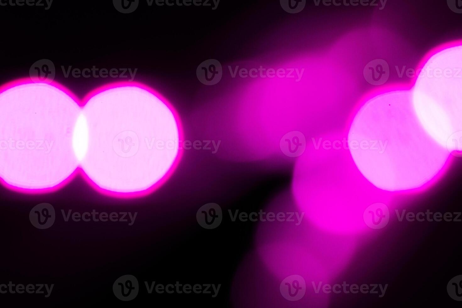 Blurred lights with purple bokeh effect Background photo
