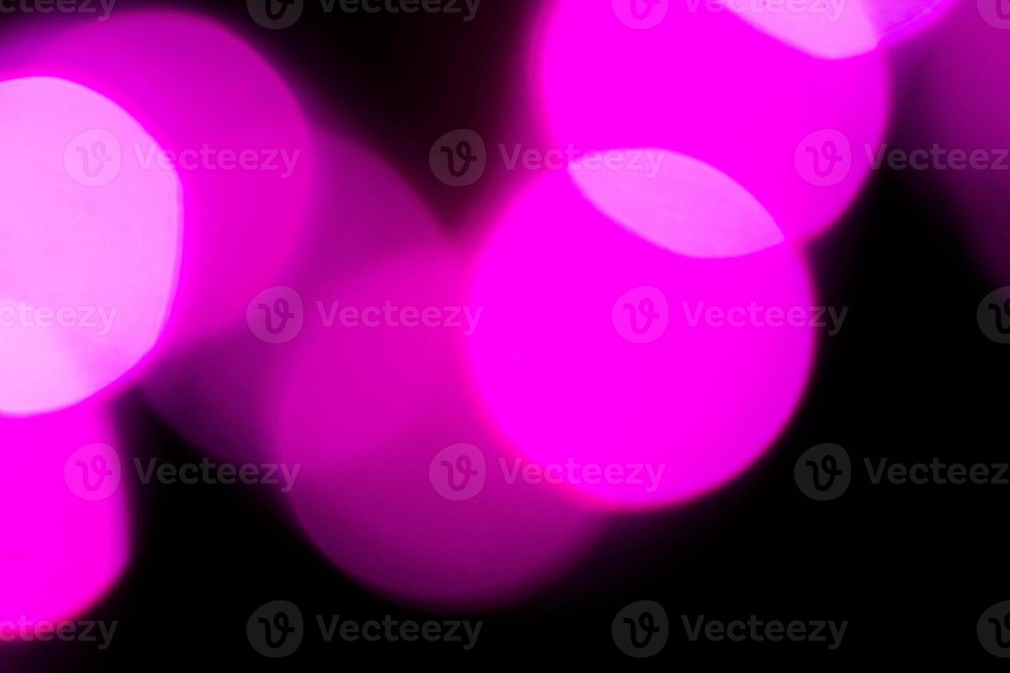 Blurred lights with purple bokeh effect Background photo