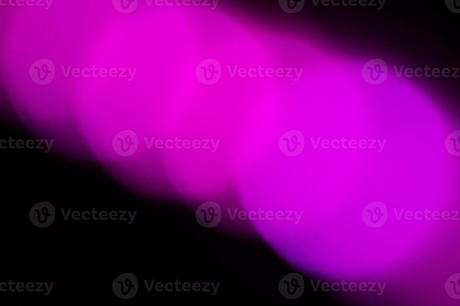 Blurred lights with purple bokeh effect Background photo