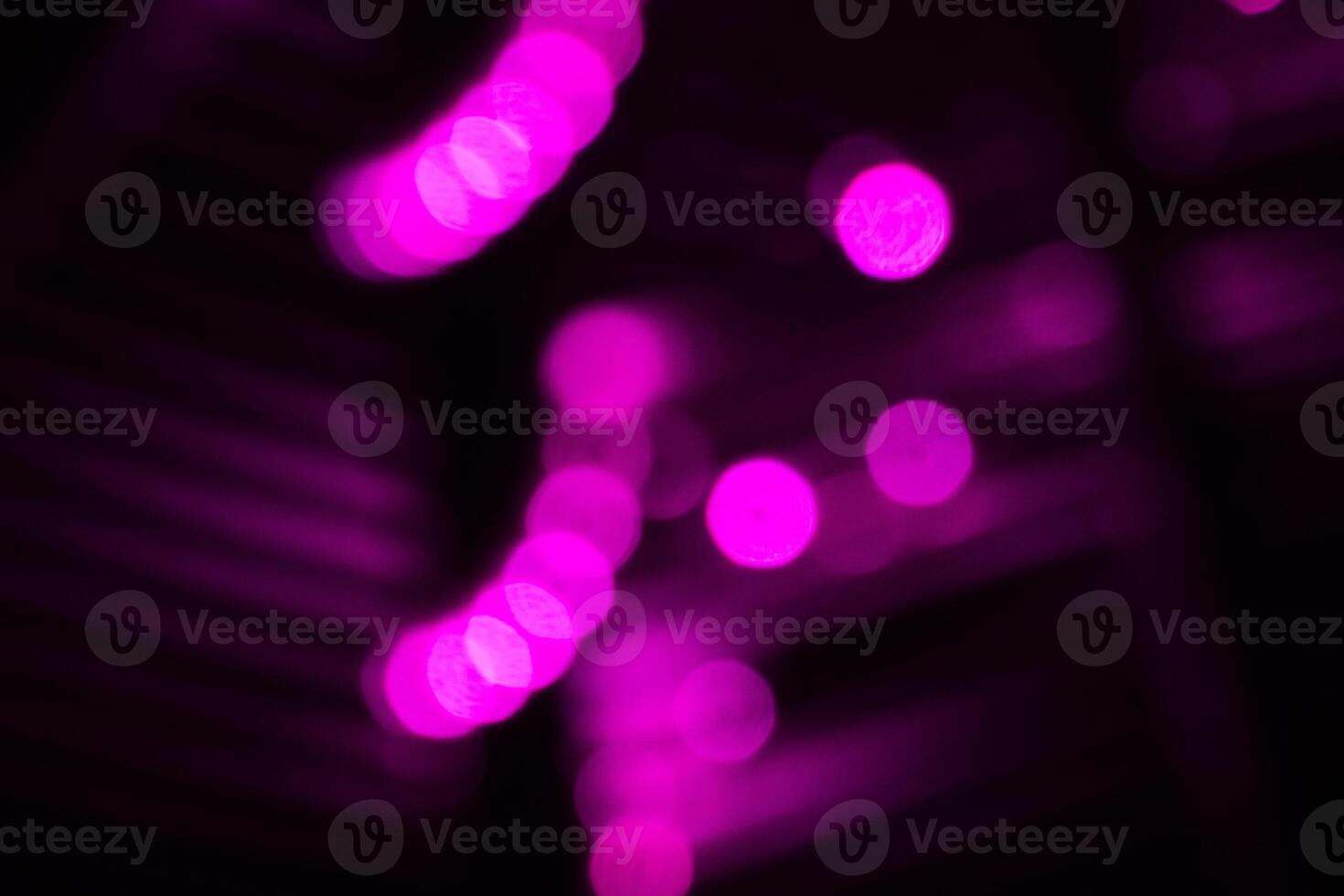Blurred lights with purple bokeh effect Background photo