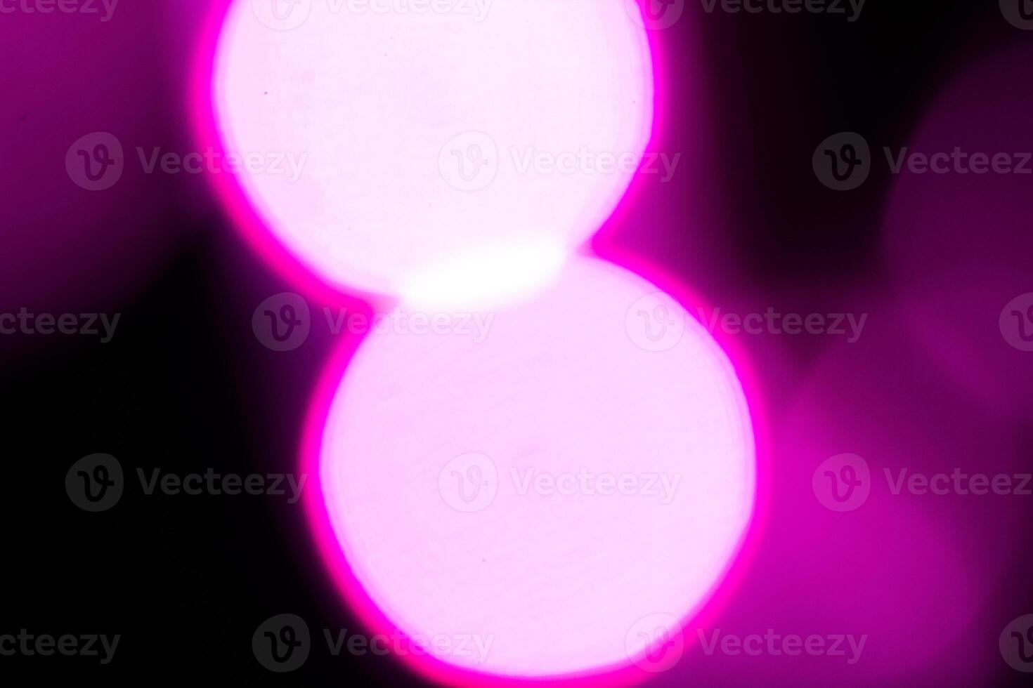 Blurred lights with purple bokeh effect Background photo