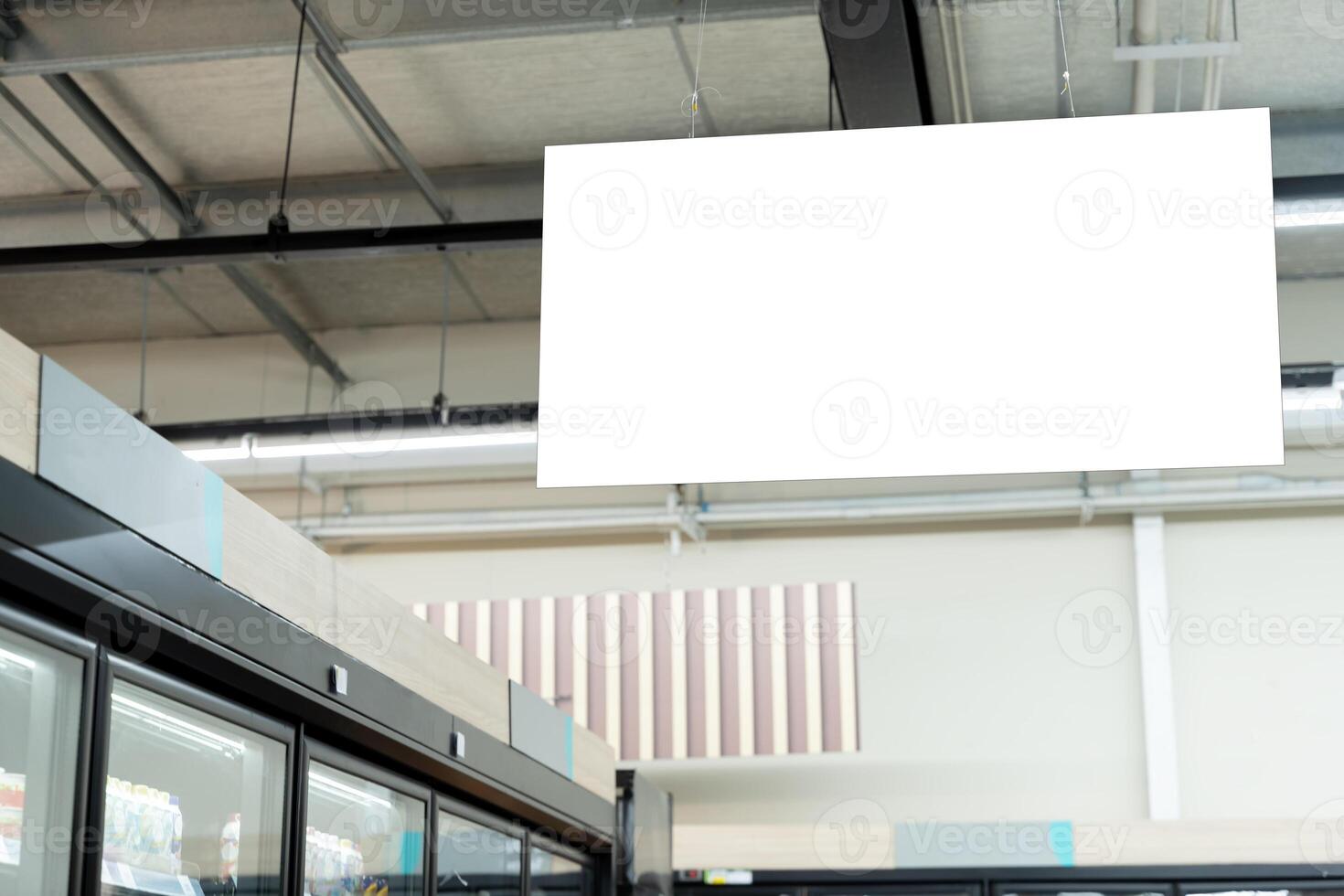 Blank billboard in progress of a trade fair or event. Blank advertising billboard hanging in the supermarket. photo