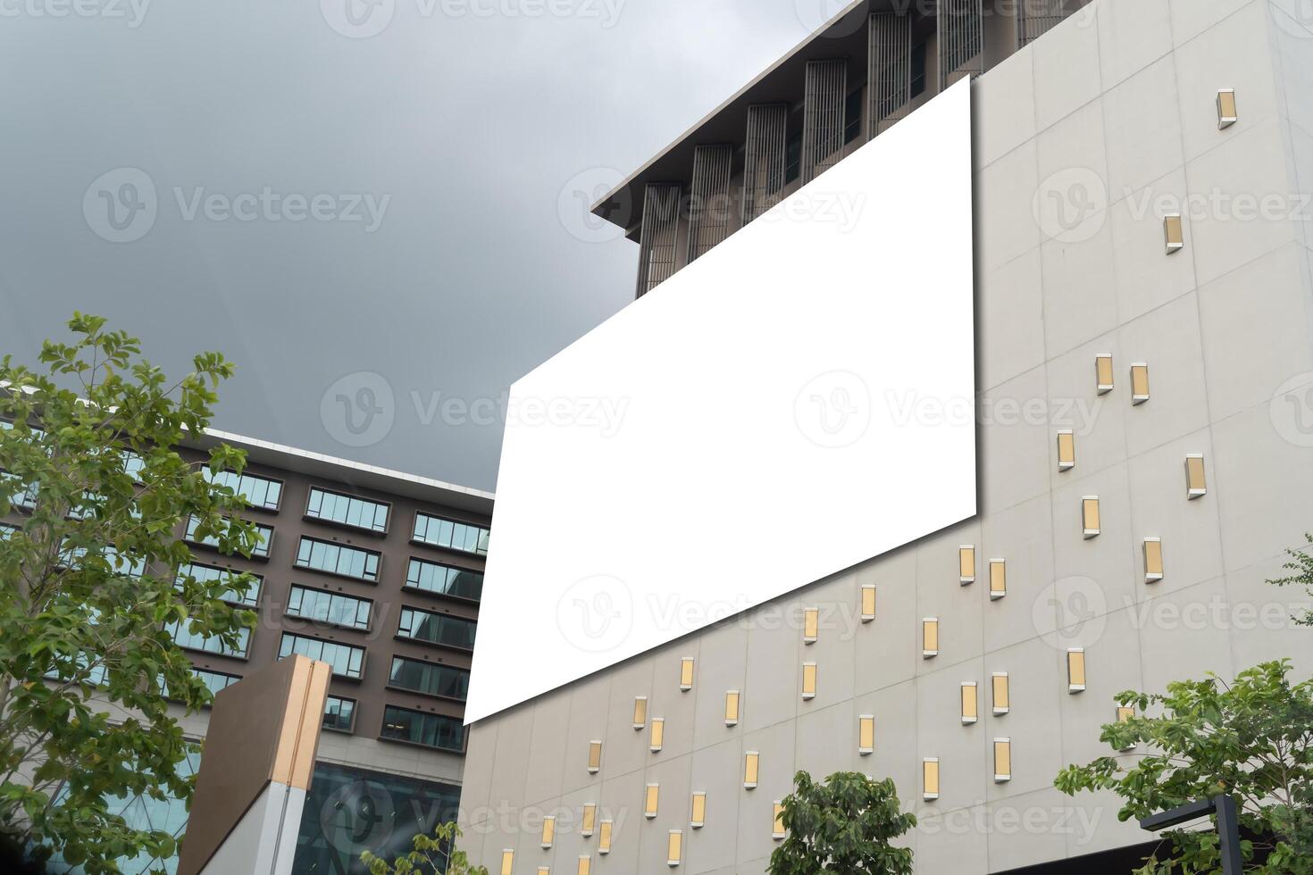 Empty white poster. Blank white billboard on the side of a tall building. photo