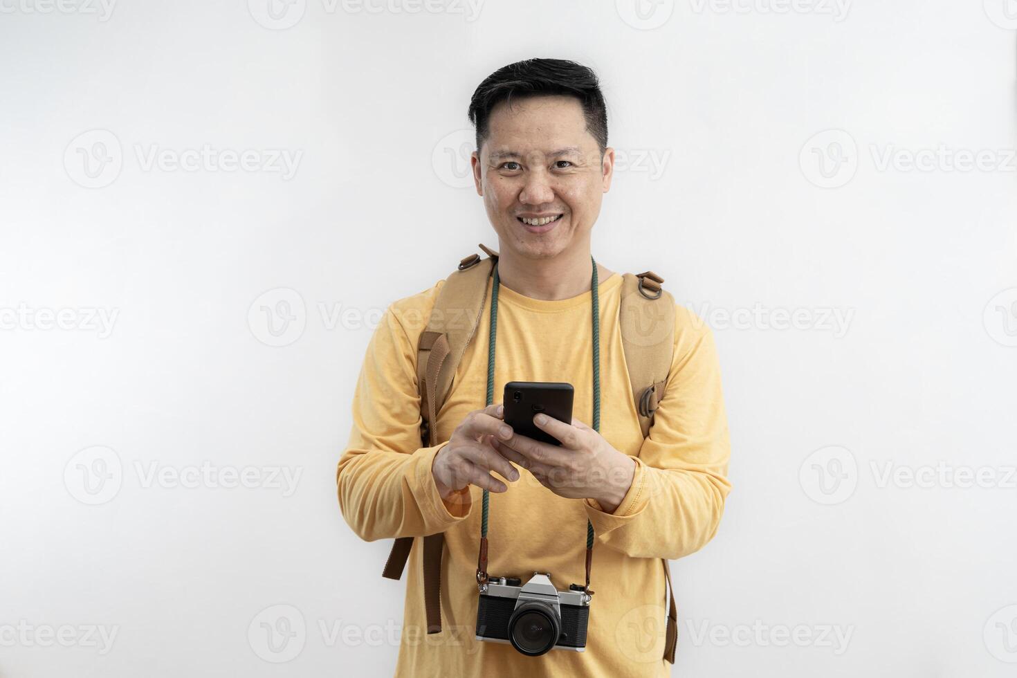 Happy traveler in summer dress using mobile phone typing sms message making winner gesture isolated photo