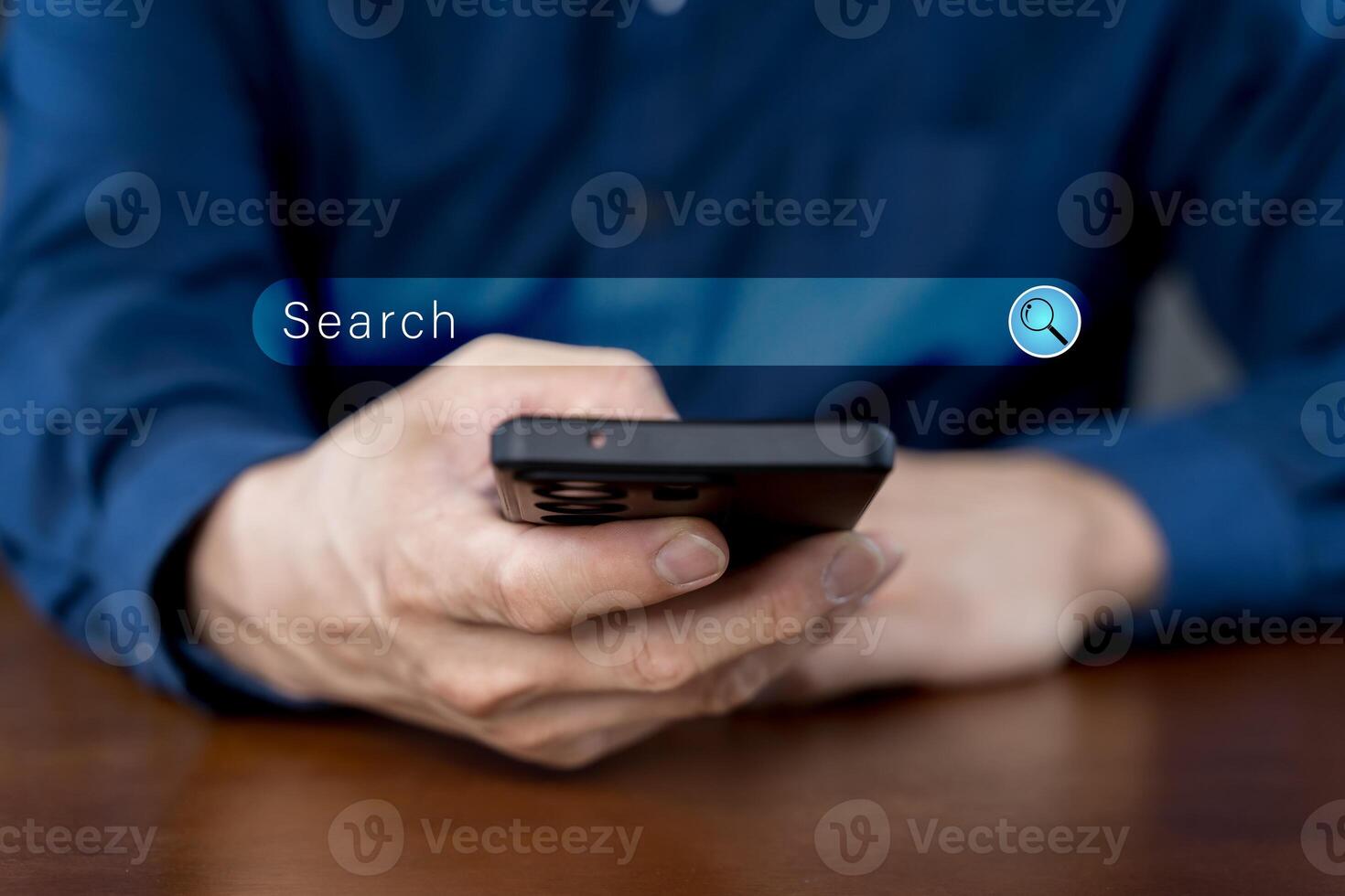 Close-up of hand a man using a mobile phone search for information interest on search engine website photo