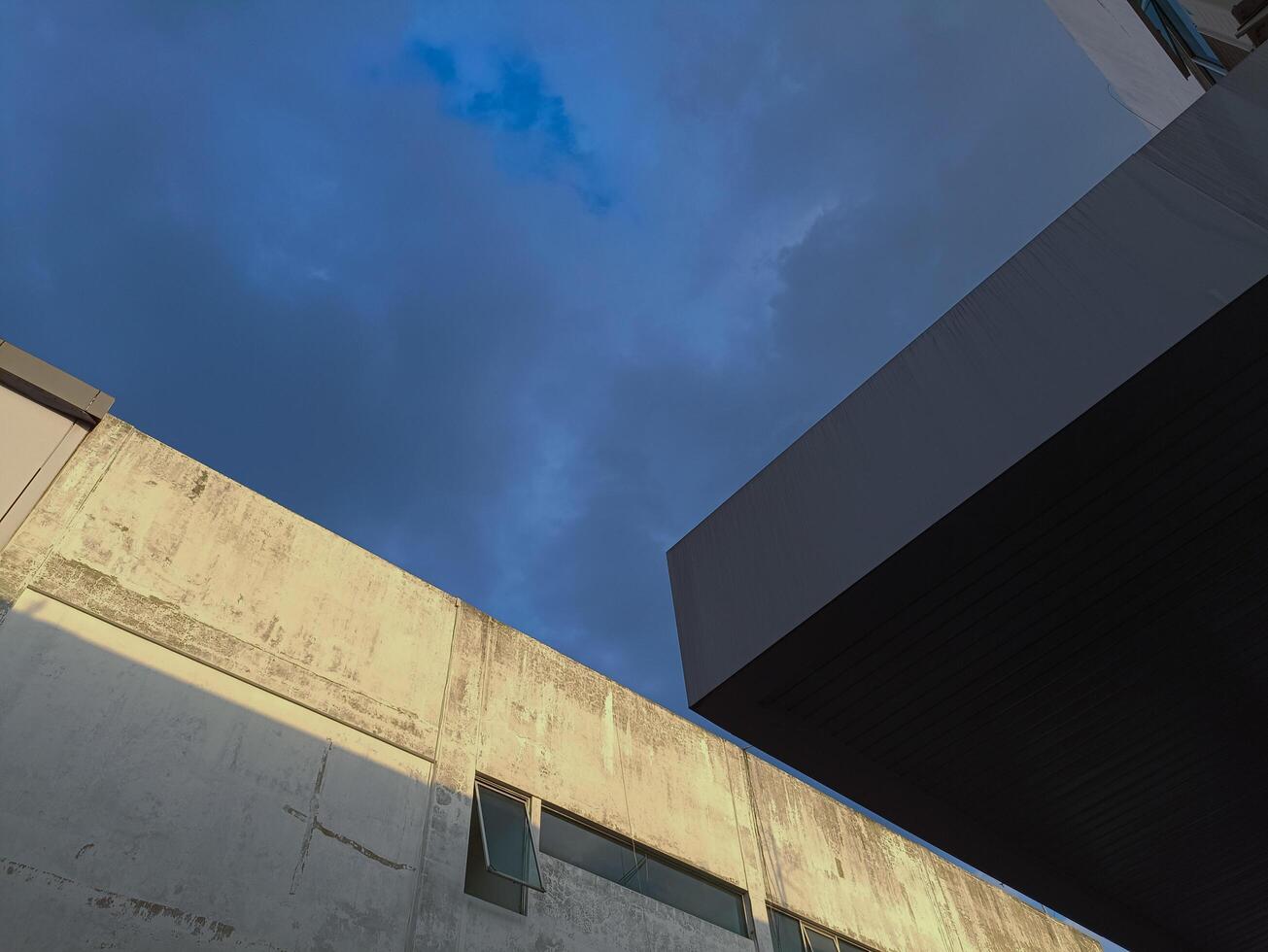 New modern block of flats in residential apartment with flat buildings exterior. Part of City Real estate property and concept. blue sky background. photo
