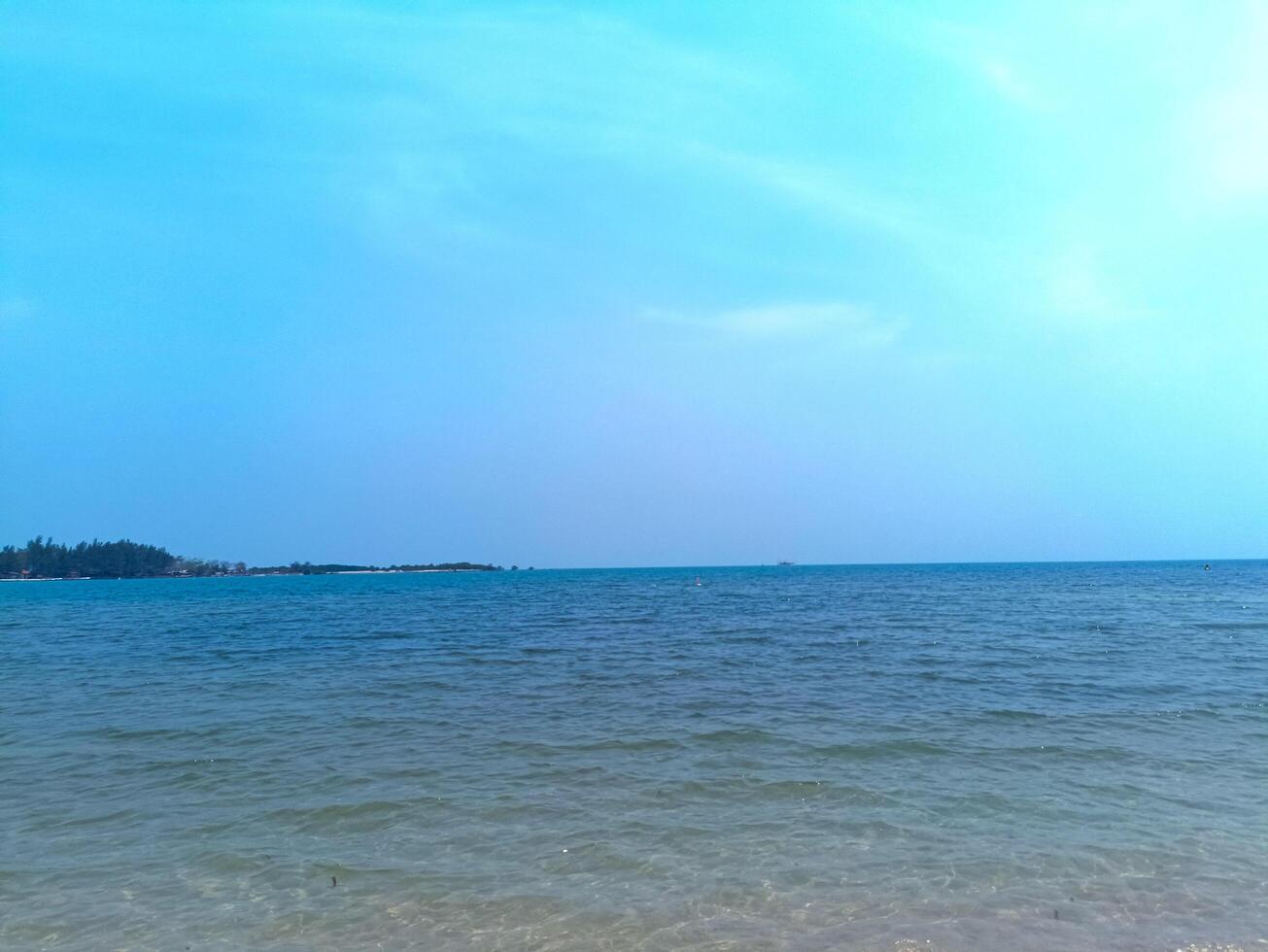 Nature landscape view of beautiful tropical beach and sea in sunny day photo