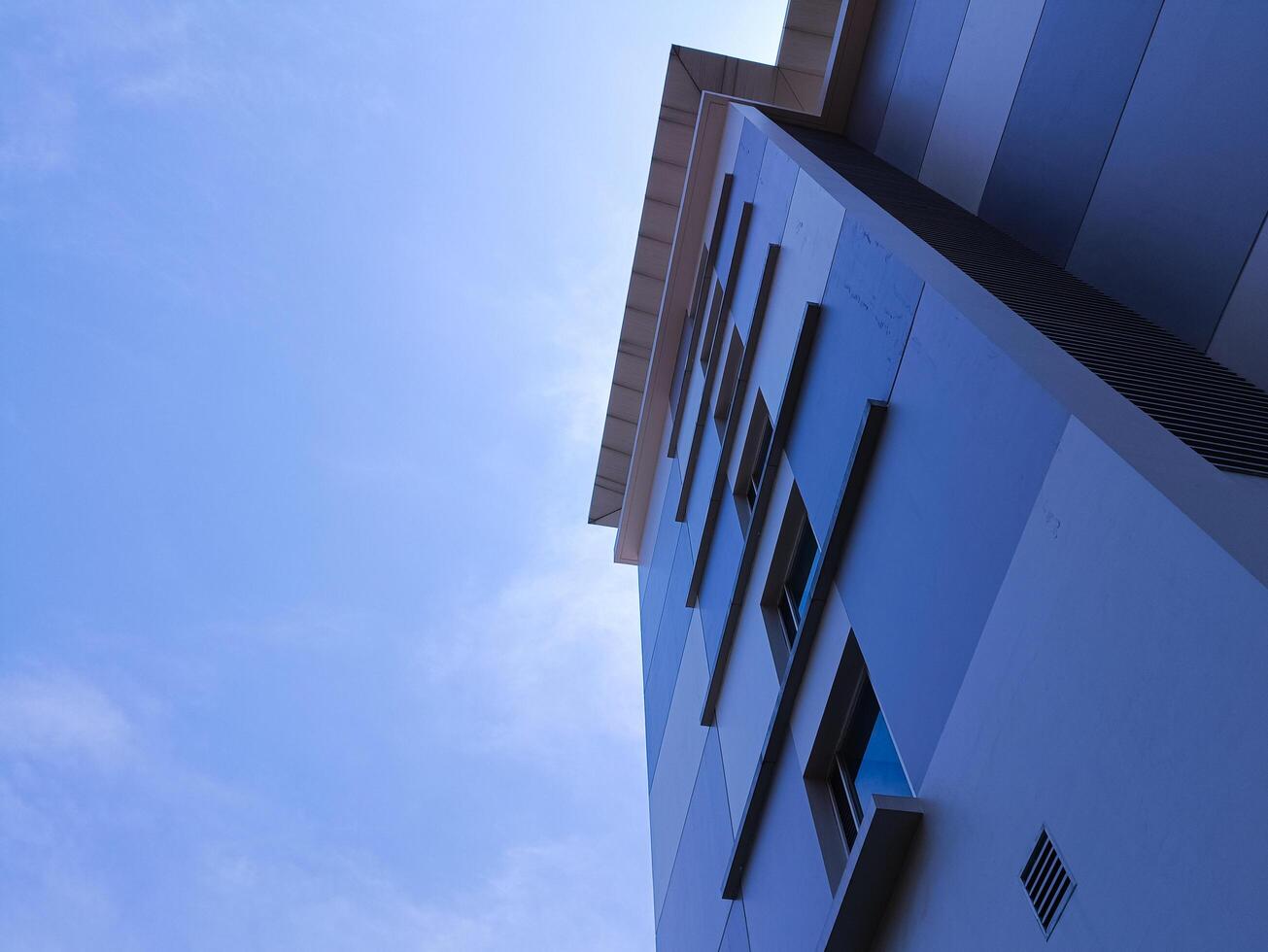 New modern block of flats in residential apartment with flat buildings exterior. Part of City Real estate property and concept. blue sky background. photo