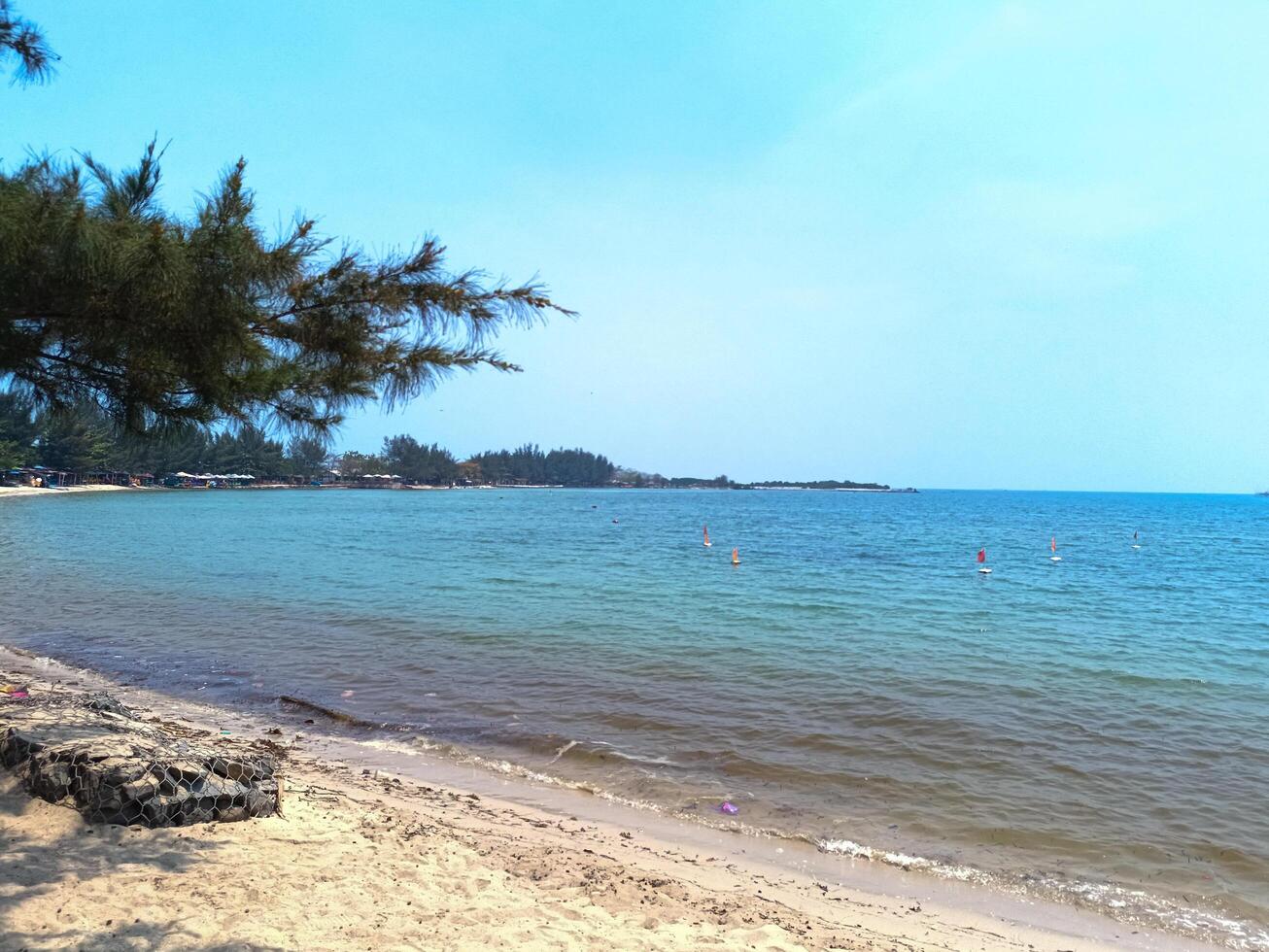 Nature landscape view of beautiful tropical beach and sea in sunny day photo