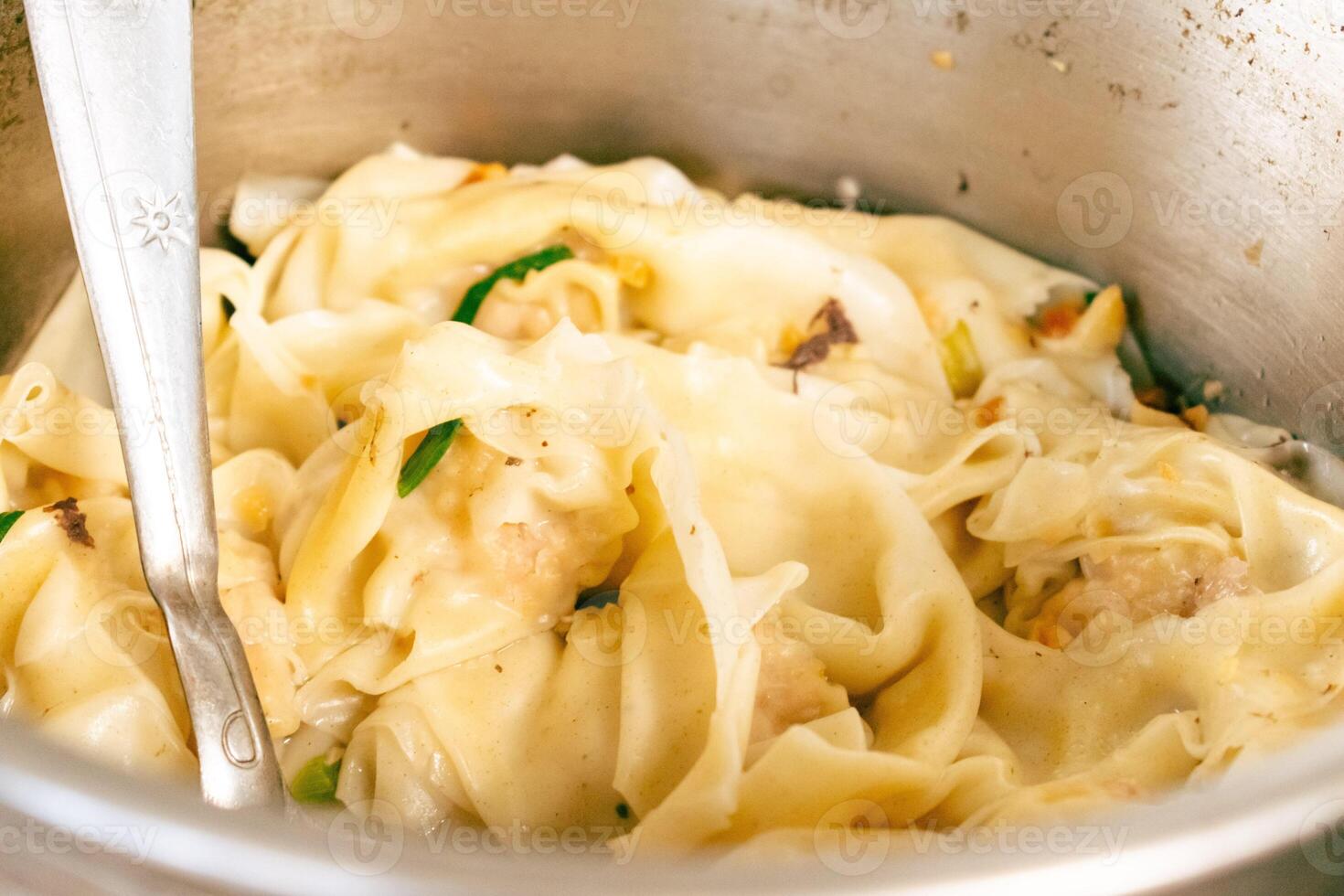 Dumpling Wonton Soup with Spoon photo