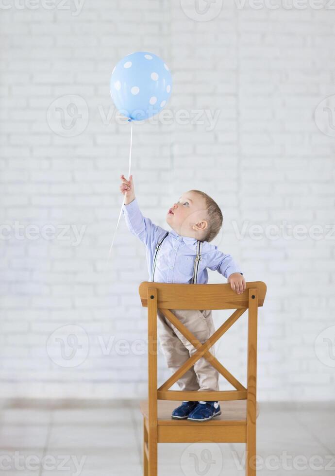 Cute little baby boy with one balloon photo