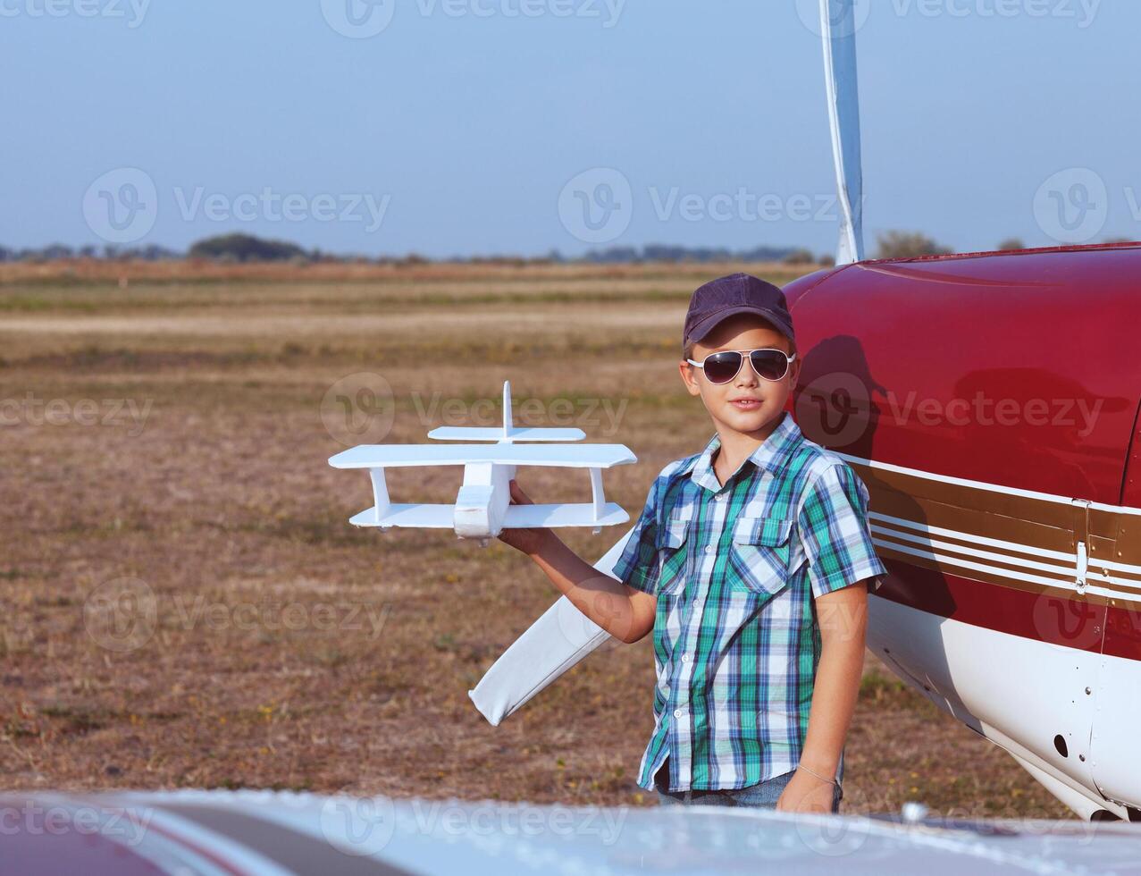 Little boy pilot with handmade plane photo