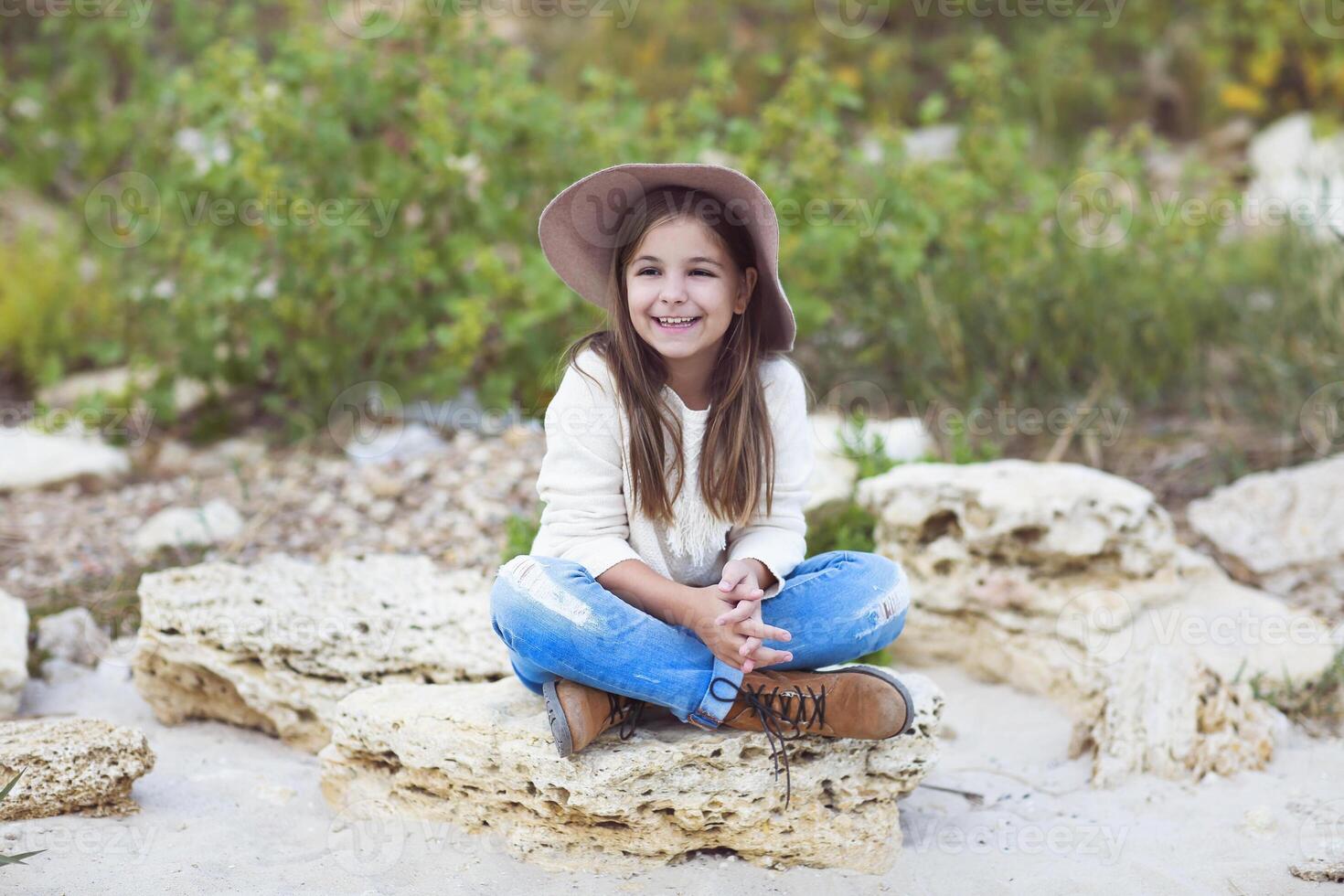 Happy little girl outdoors photo