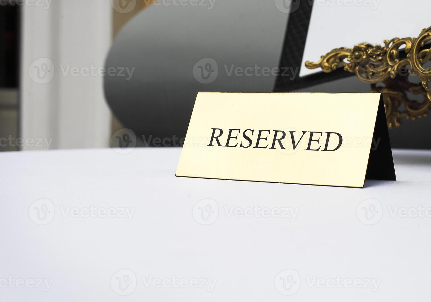 Reserved sign on the table in restaurant photo