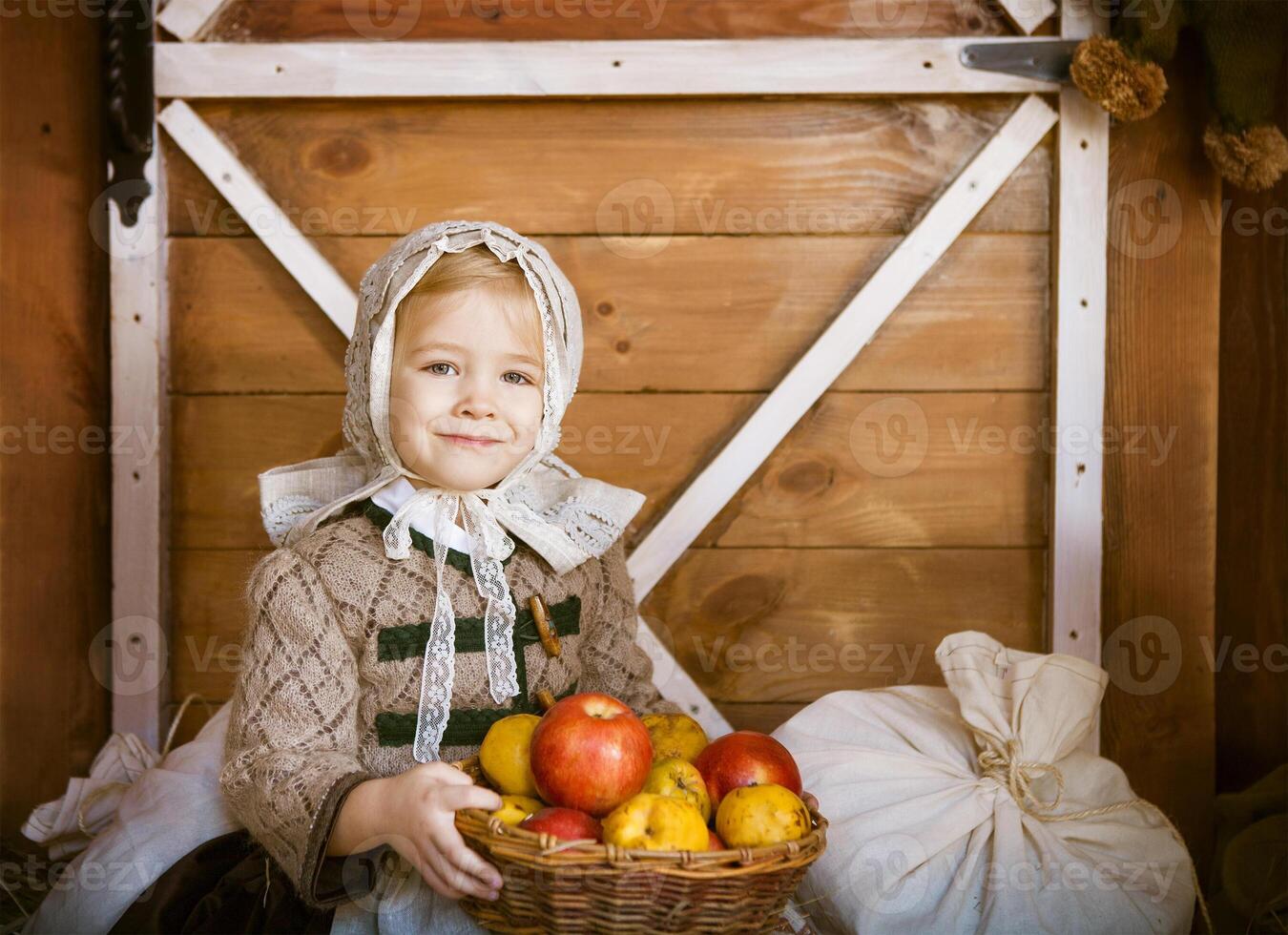 Vintage styled photo of little smiling girl in farm
