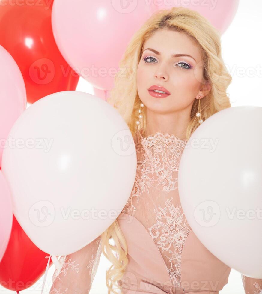 Romantic portrait of a beautiful girl with balloons photo