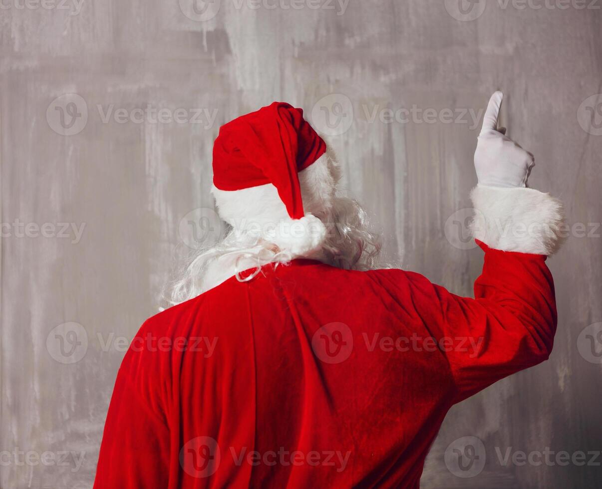 Santa Claus pointing and rear view photo