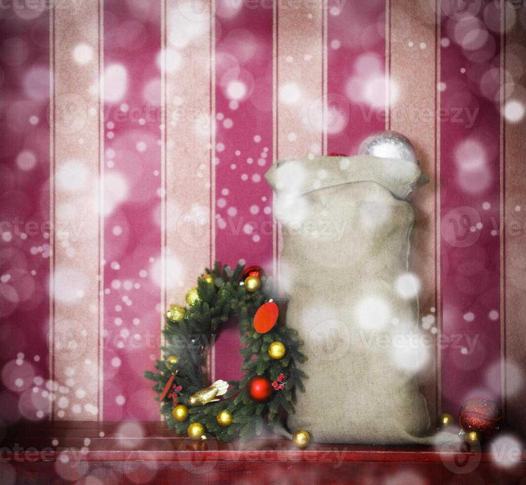 Christmas tree balls, placed in and around Santa Claus bag photo