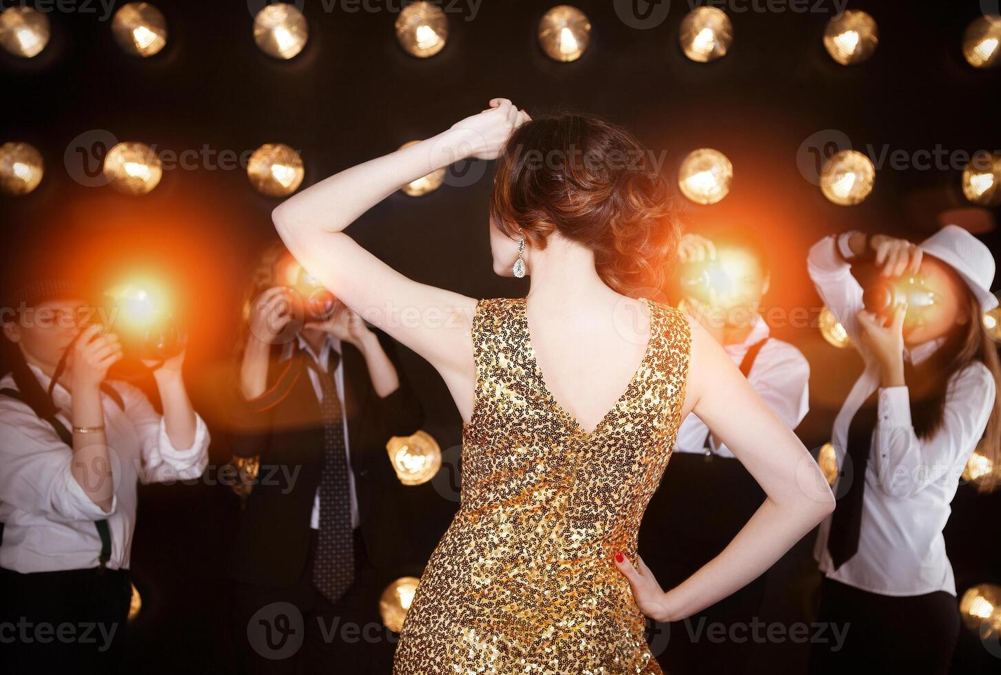 Superstar woman posing to paparazzi photo