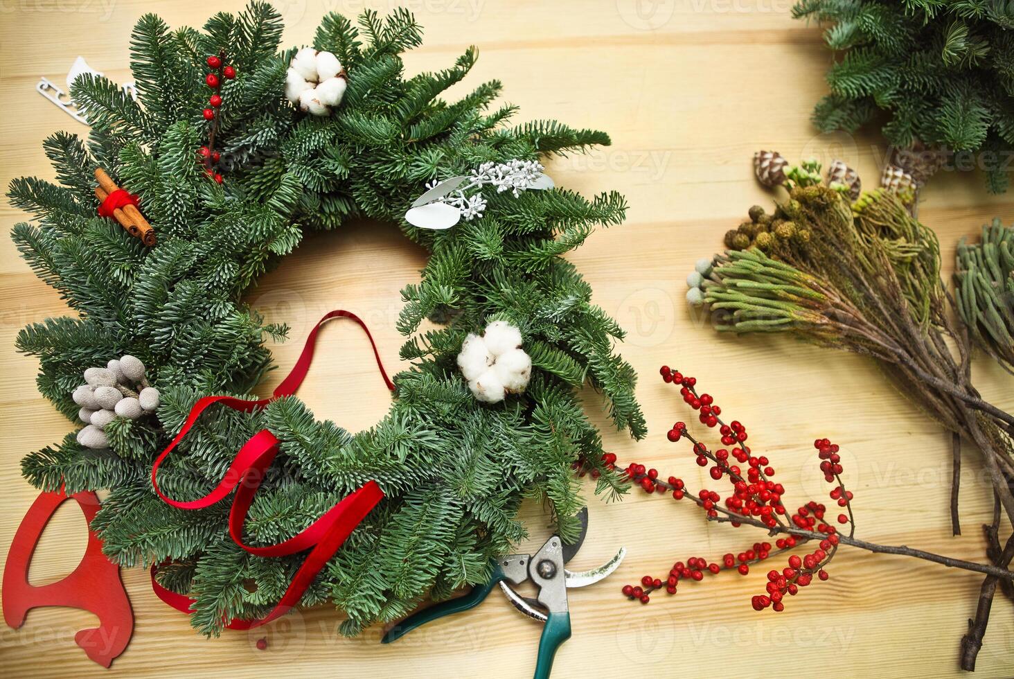 Decorating Christmas wreath on the table photo