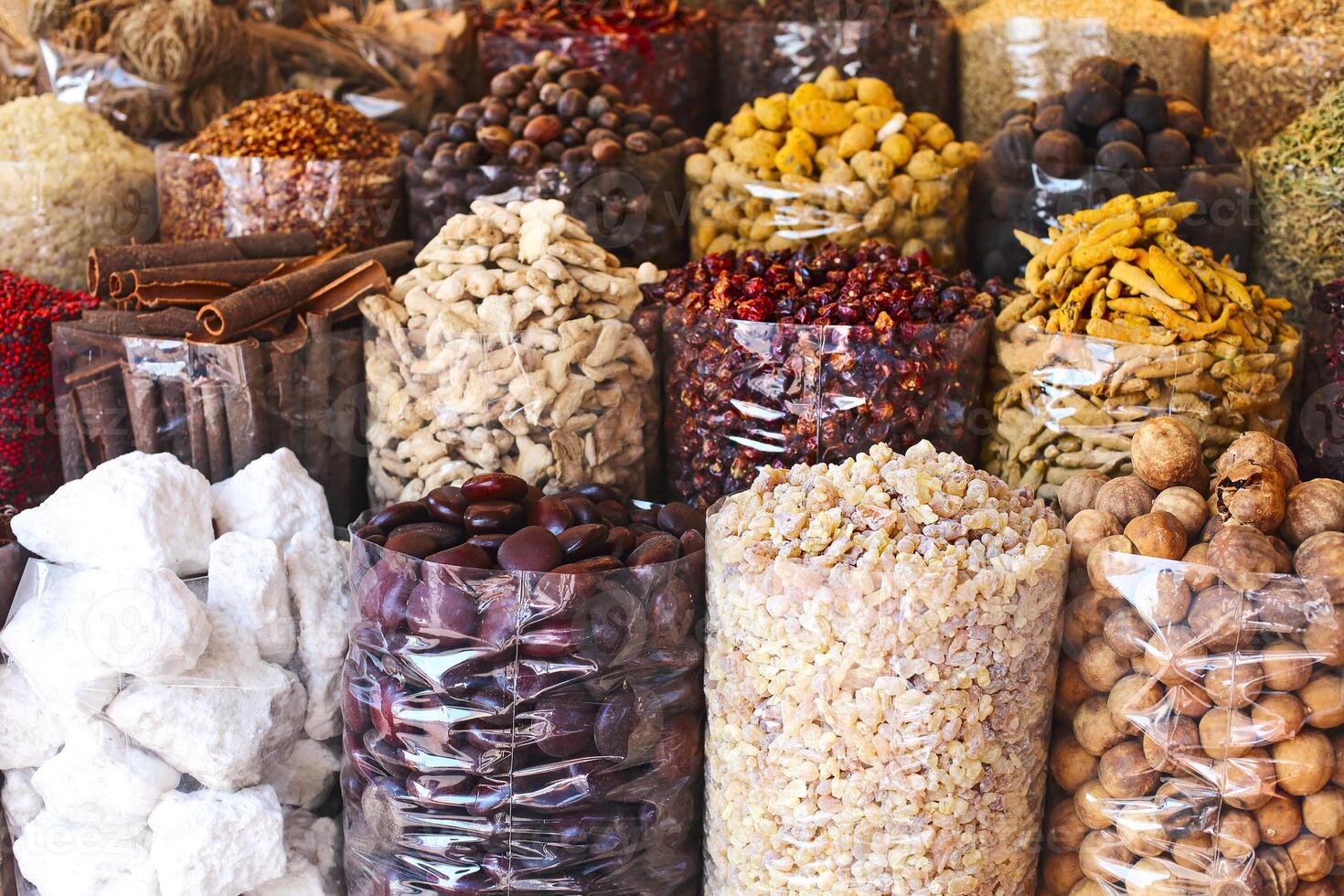 Spices and herbs being sold on street stall at arab traditional market photo