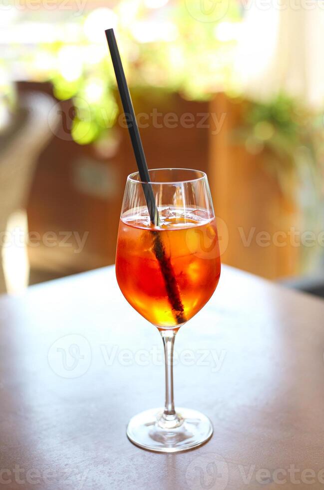 Cocktail glass on wooden table photo