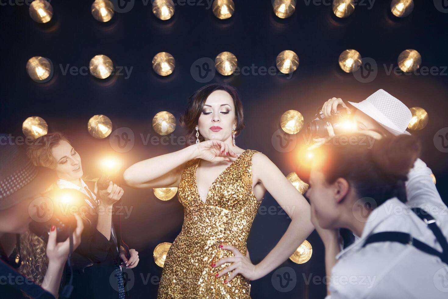 Superstar woman posing to paparazzi photo