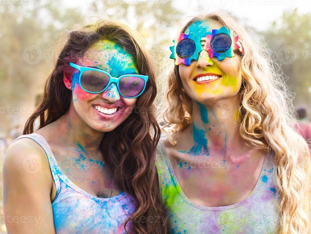 Portrait of happy girls on holi color festival photo