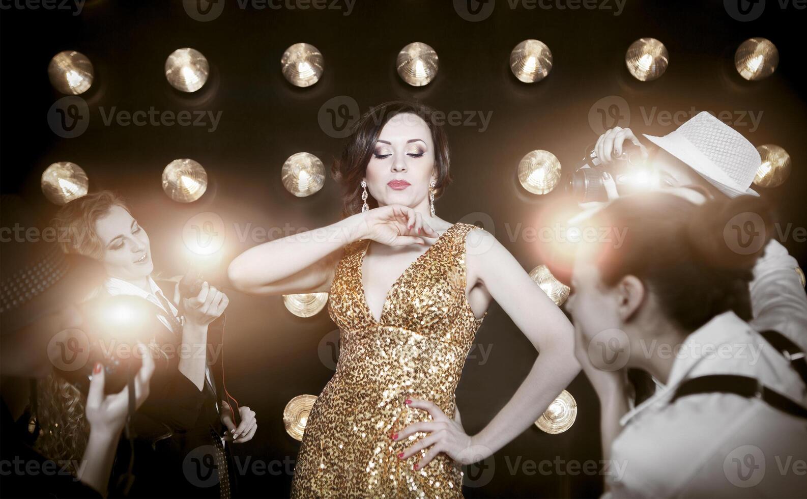 Superstar woman posing to paparazzi photo