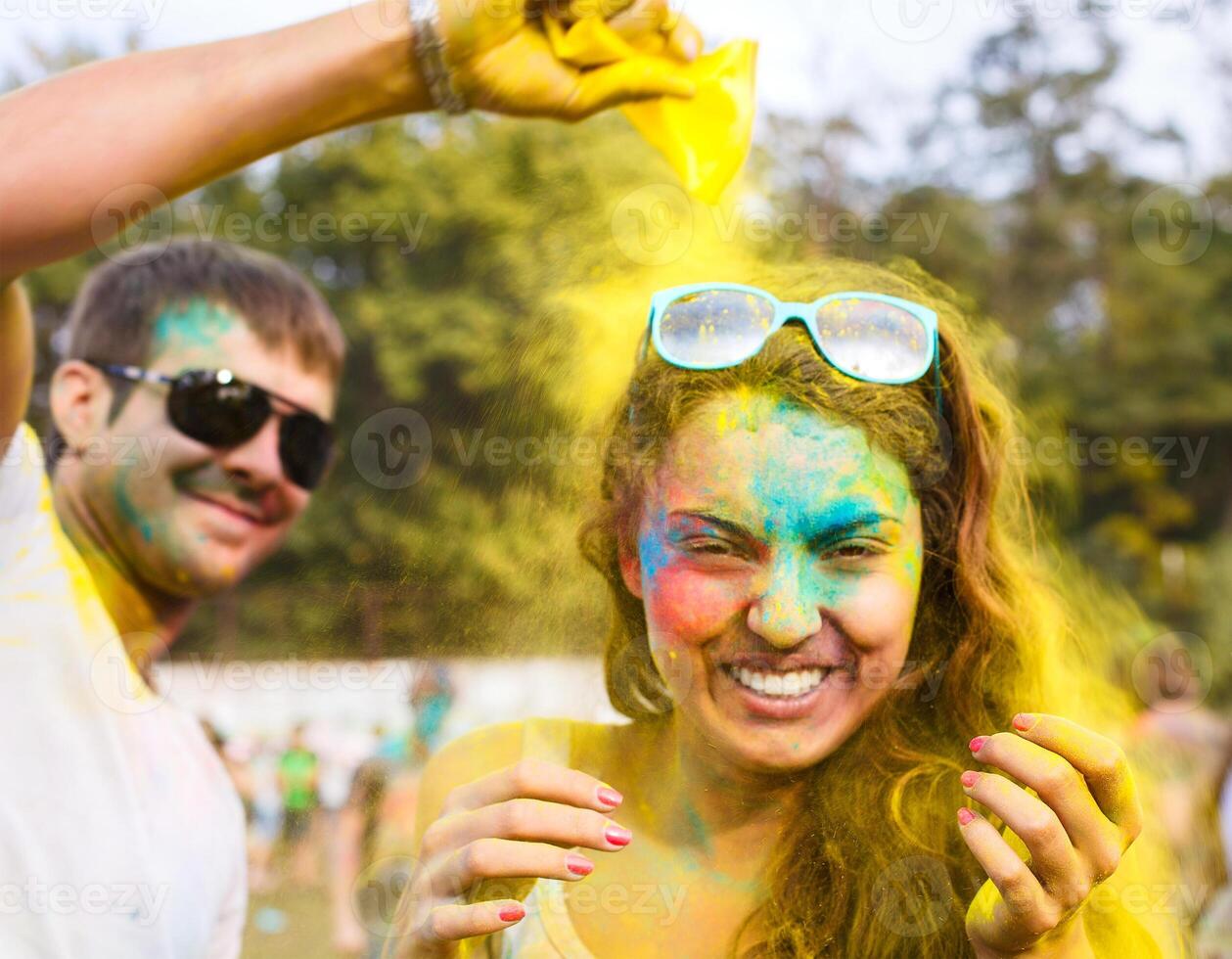 Happy couple in love on holi color festival photo