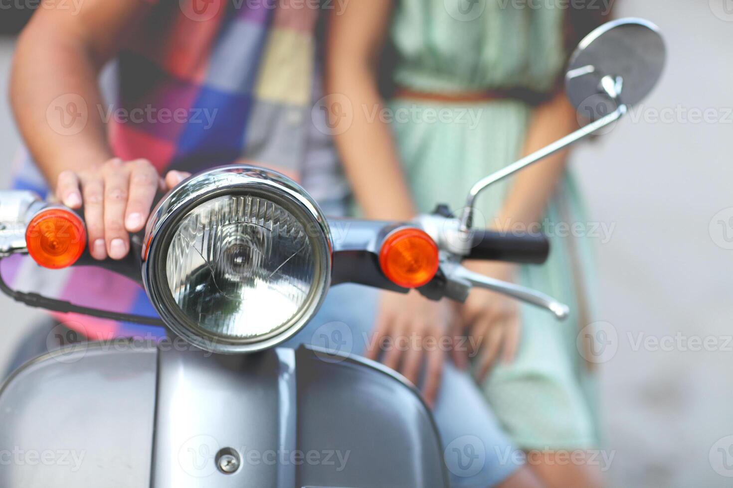 Young happy couple near the old retro scooter photo