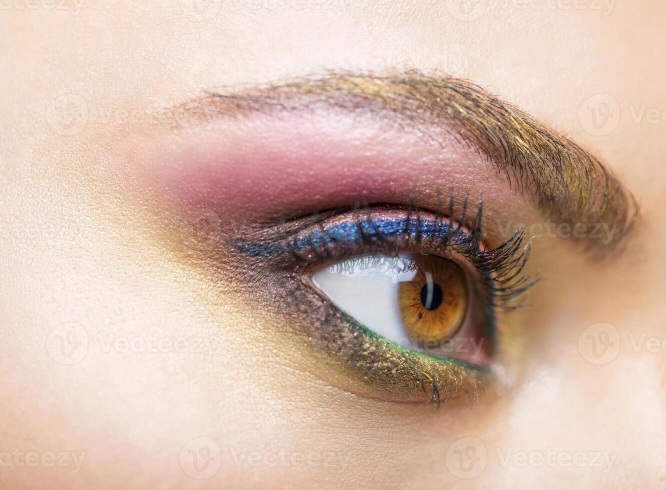Close up portrait of a beautiful young model with bright make up photo