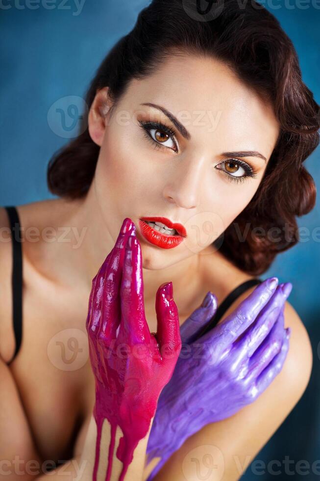 Beautiful young woman with bright make up photo