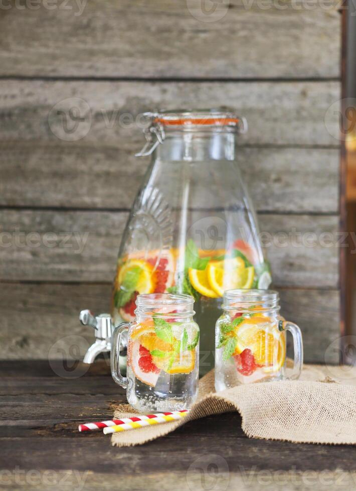 Lemonade with lemon, orange and grapefruit photo