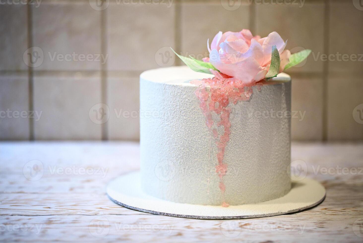 Wedding cake beautiful decorated with pink roses and sugar photo