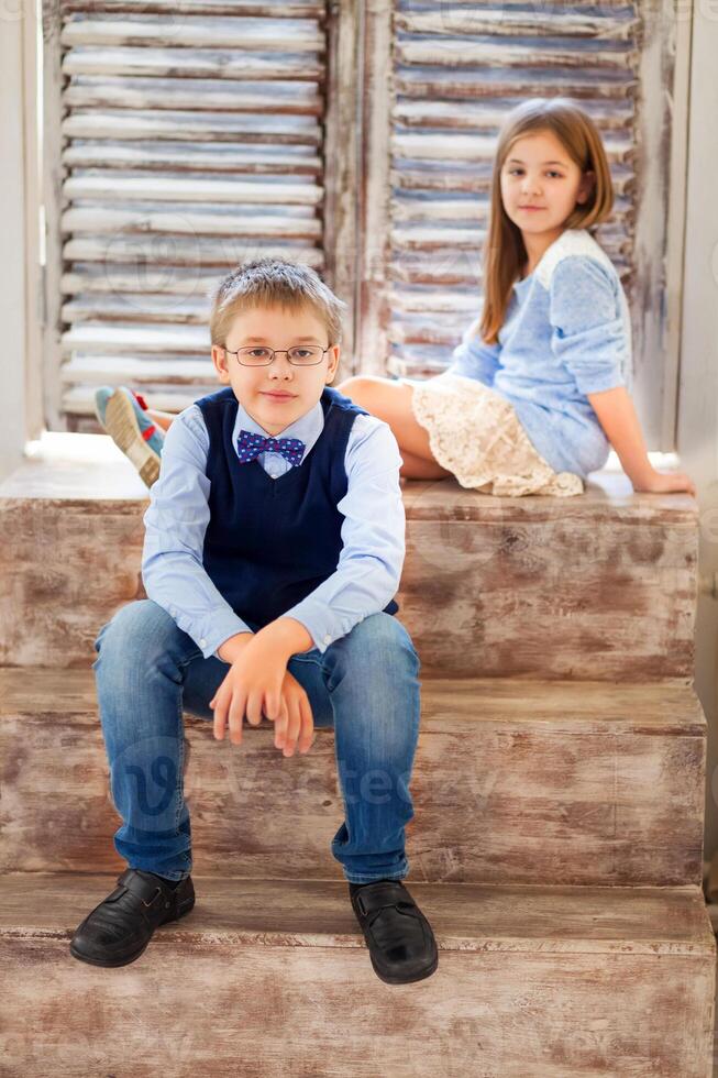 Portrait of a happy girl and a smiling boy photo