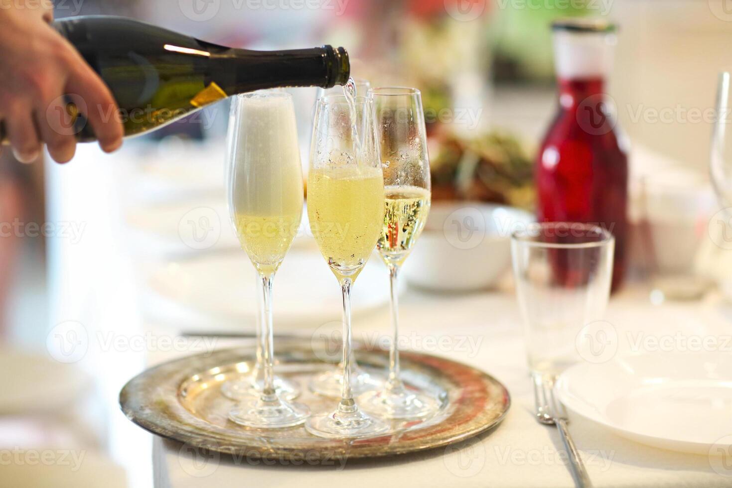 Champagne glasses and bottle in restaurant photo