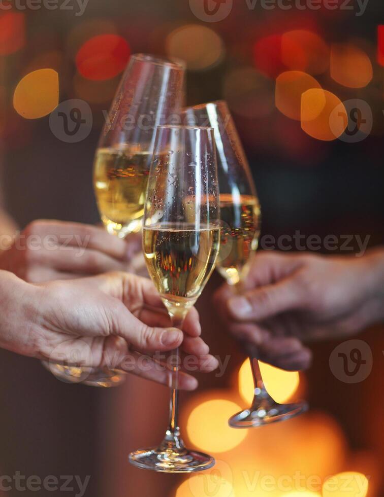 Champagne glasses on red and yellow bokeh background photo