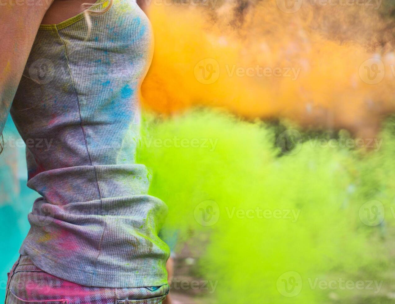 Happy young girl on holi color festival photo