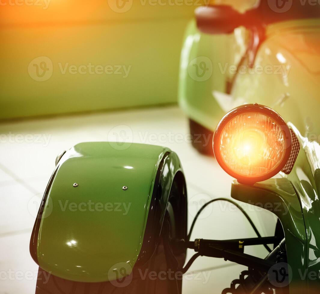 Green retro car headlight photo