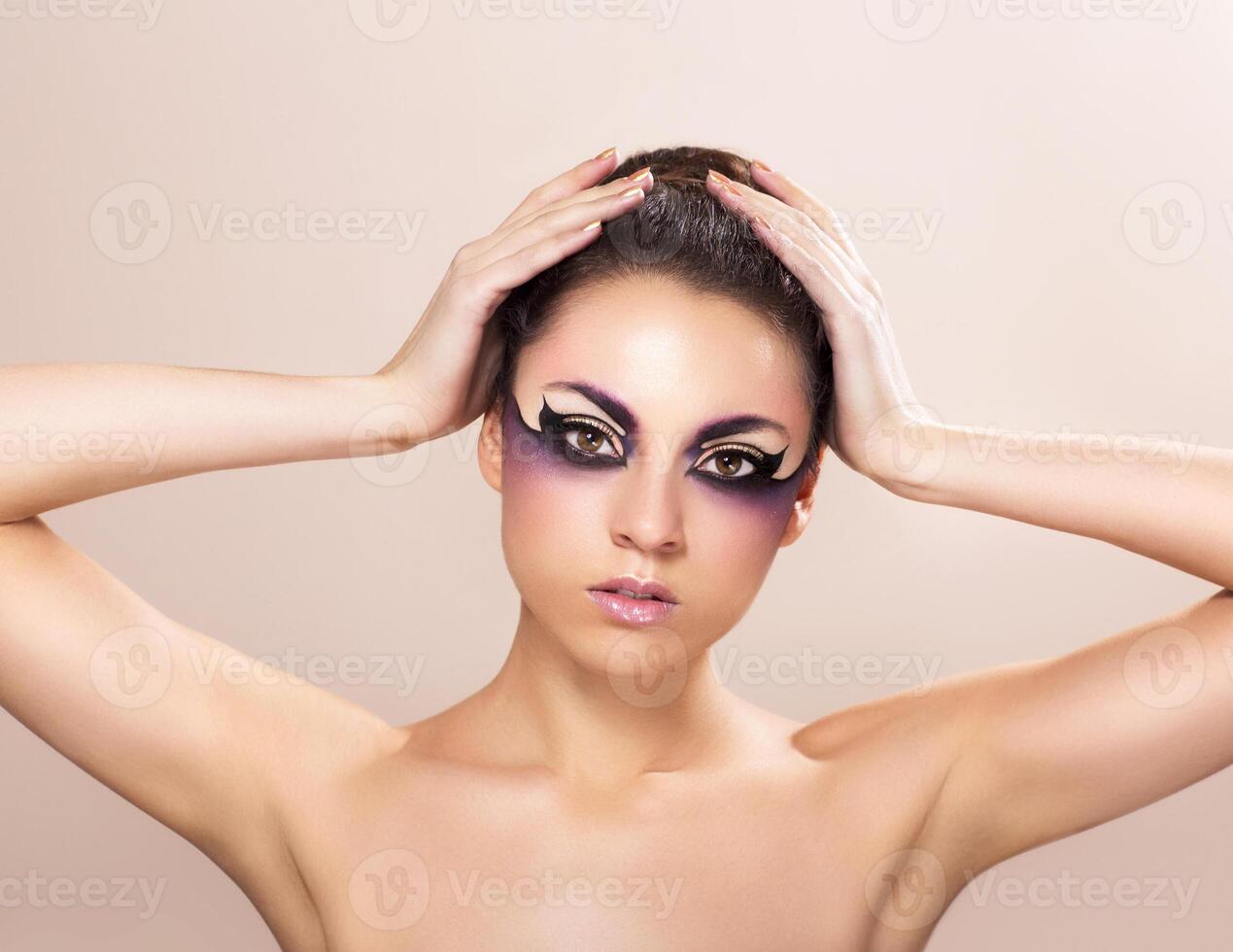 Beautiful young woman with fantasy makeup photo