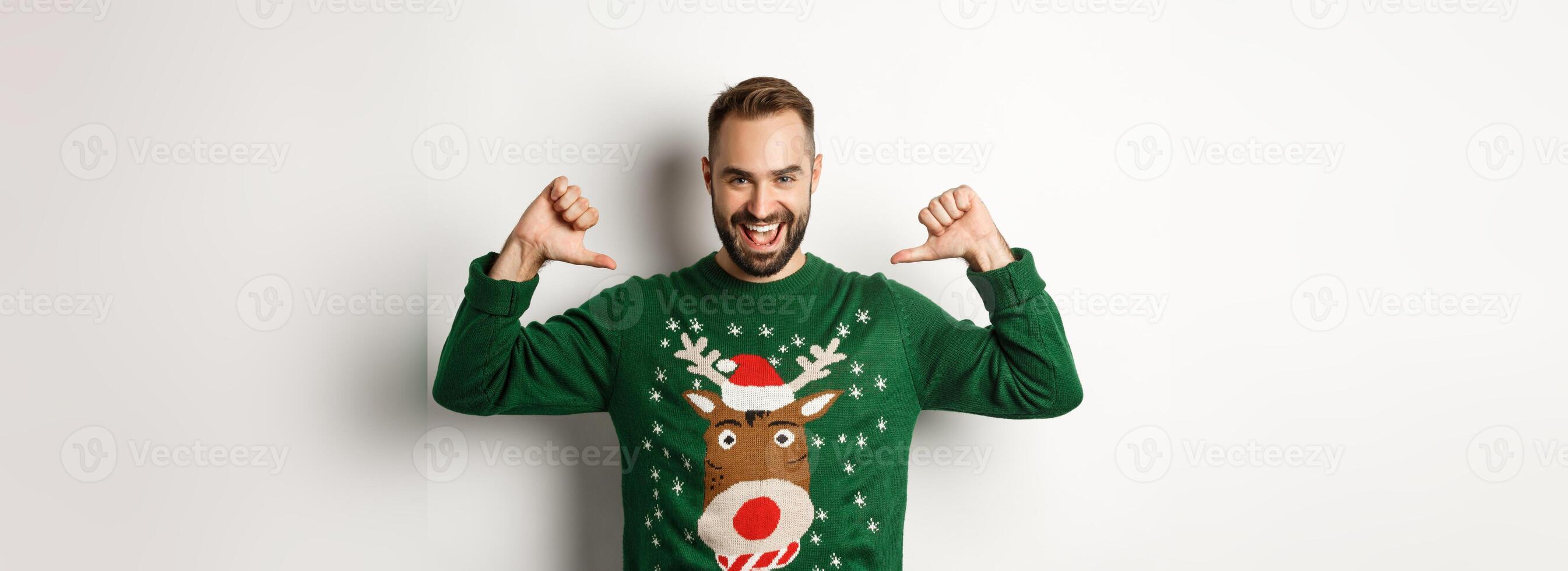 Winter holidays and christmas. Confident young man looking enthusiastic, pointing at himself proudly, standing over white background photo