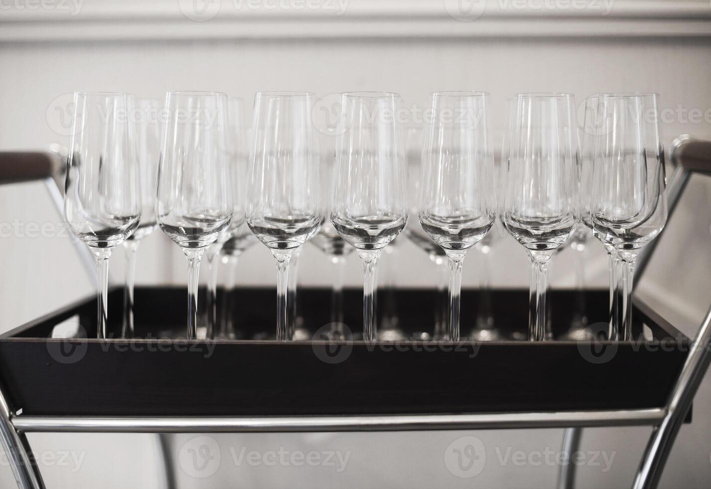 Wine glasses on tray at restaurant photo