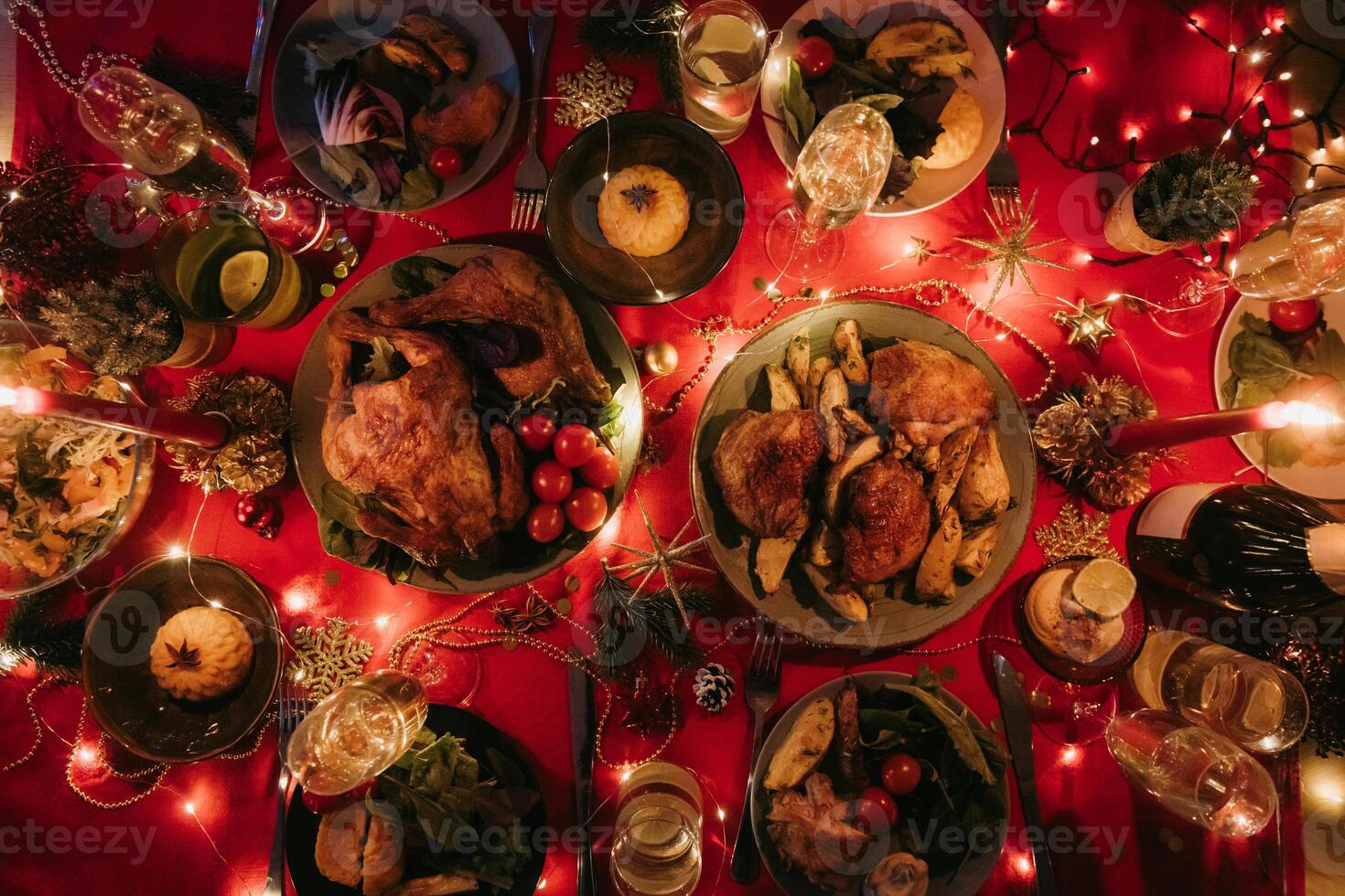Top view no people shot of decorated Christmas table with variety of food and atmosphere of New Year Eve photo