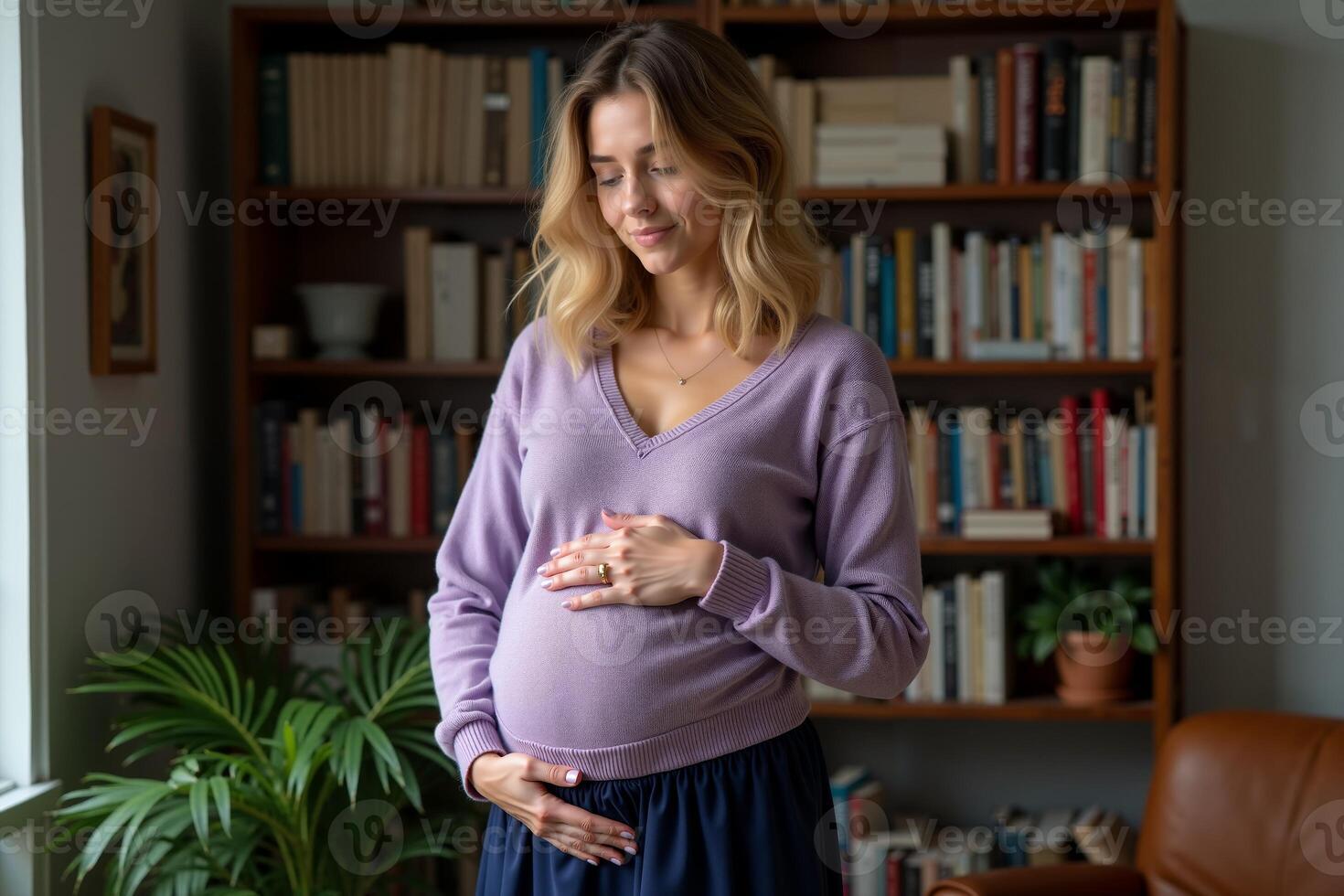 photo of pregnant woman standing with shelf of book on background,