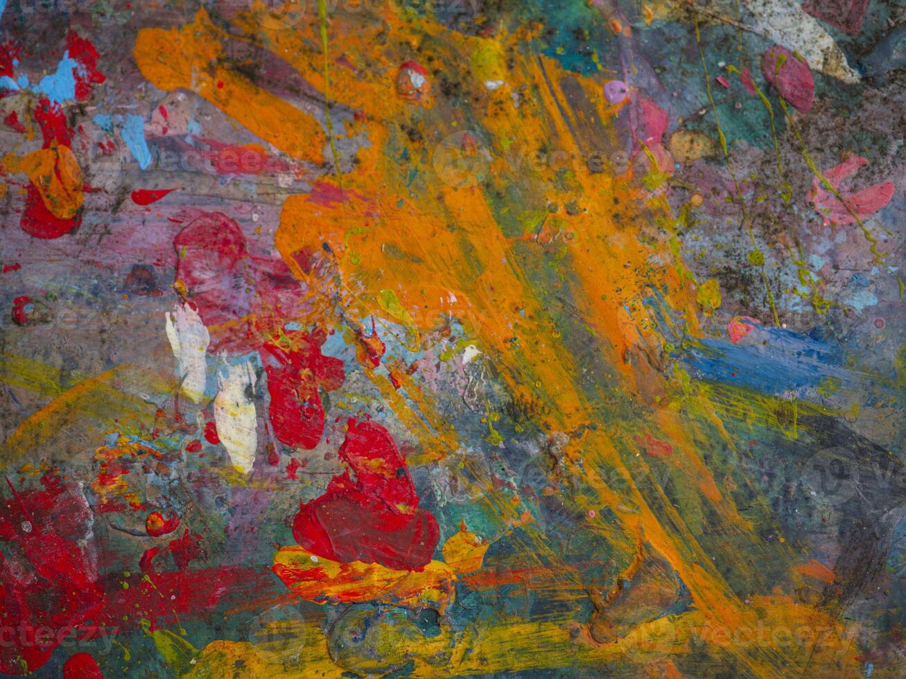 Smeared paint on table with colorful pattern for background photo