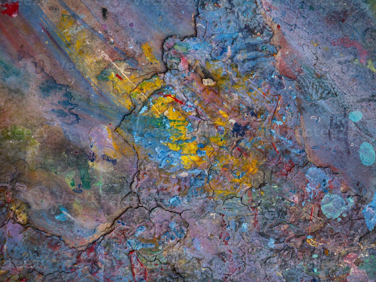 Smeared paint on table with colorful pattern for background photo