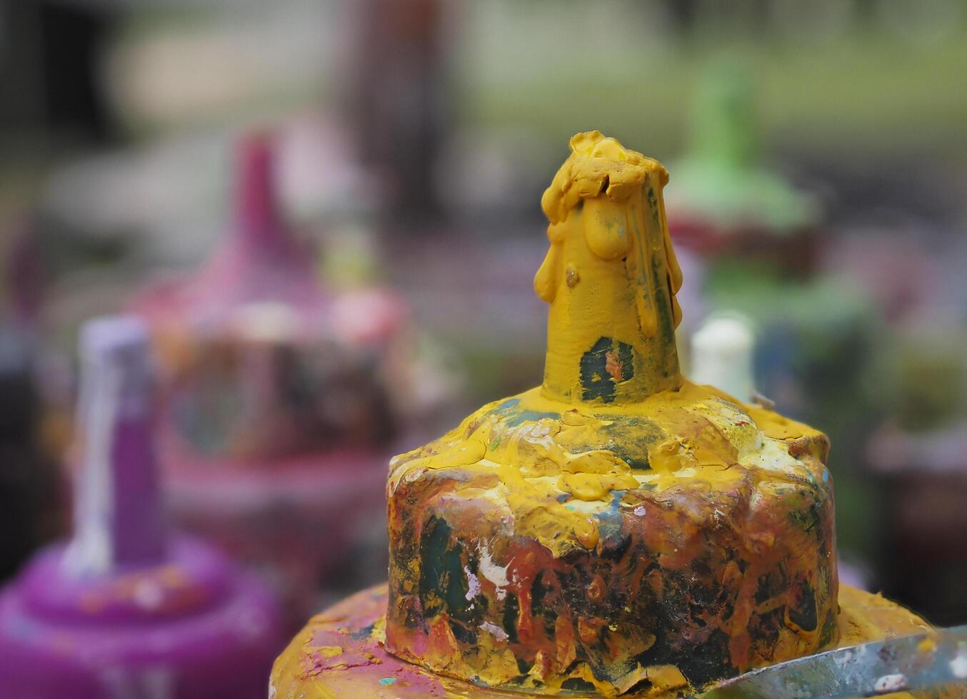 Colorful paint bottles in an old basket photo
